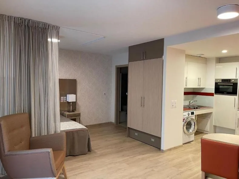 Overall view of the studio: sleeping area, armchair, wardrobe and kitchenette, Appart-One aparthotel, Aix-les-Bains